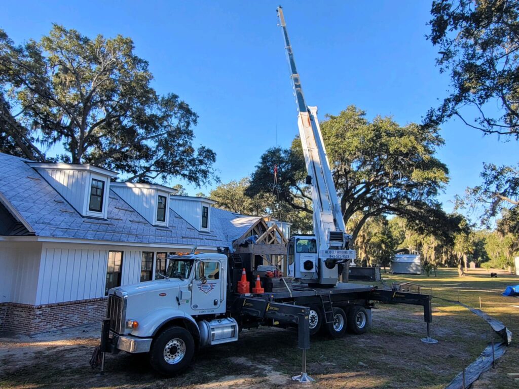 Crane truck working on house