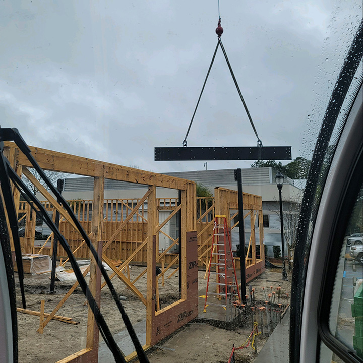 Crane truck working on house